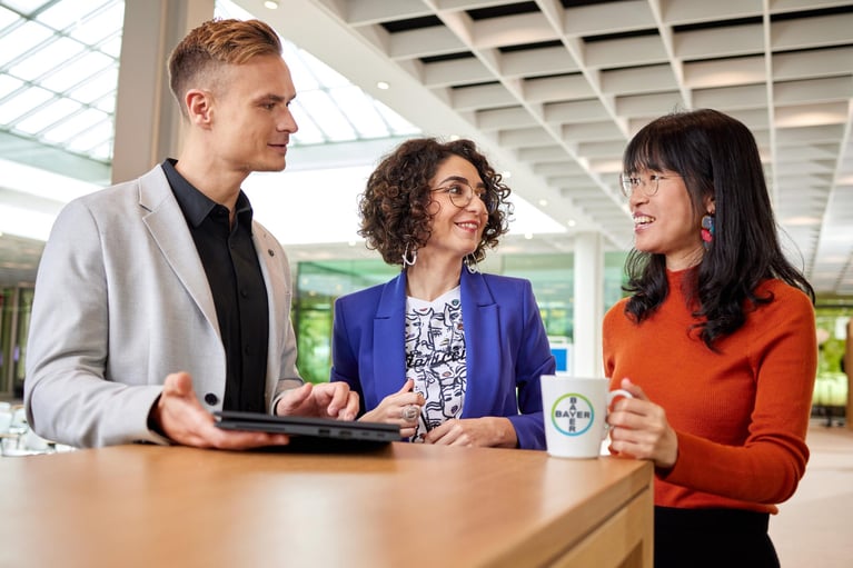 bayer-employees-discussing-2.jpg