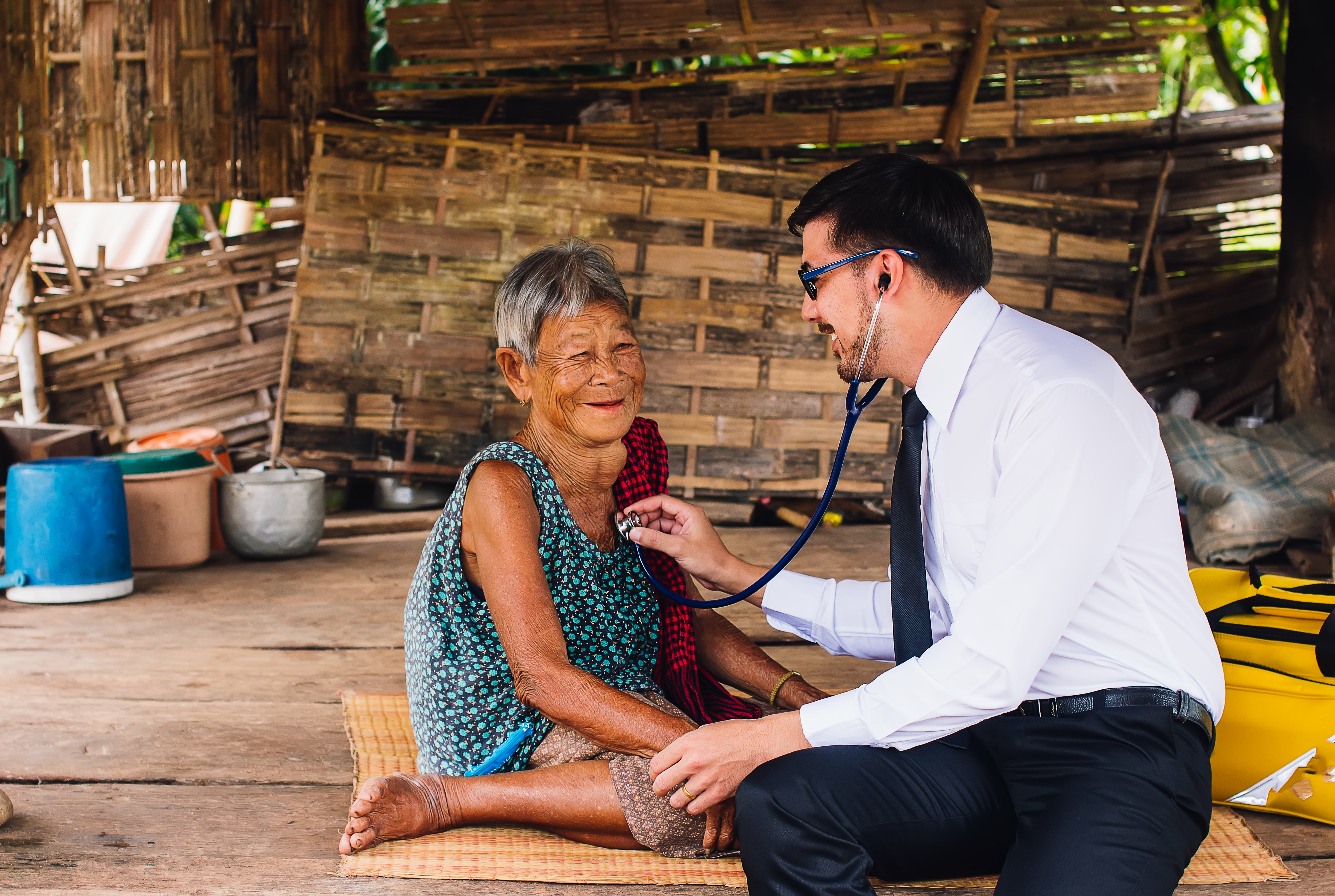 male_doctor_examining_asian_woman.jpeg