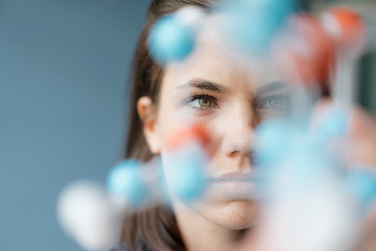 scientist studying molecule model