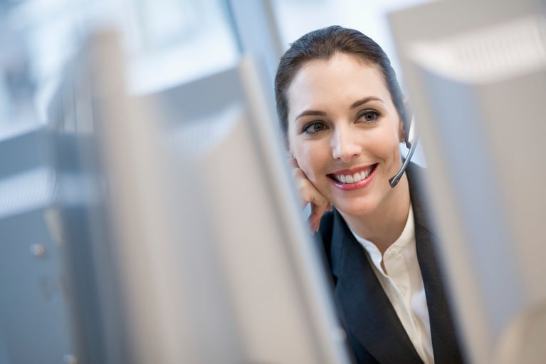 Businesswoman using headset