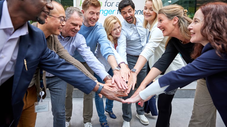 employees-put-their-hands-together-2.jpg