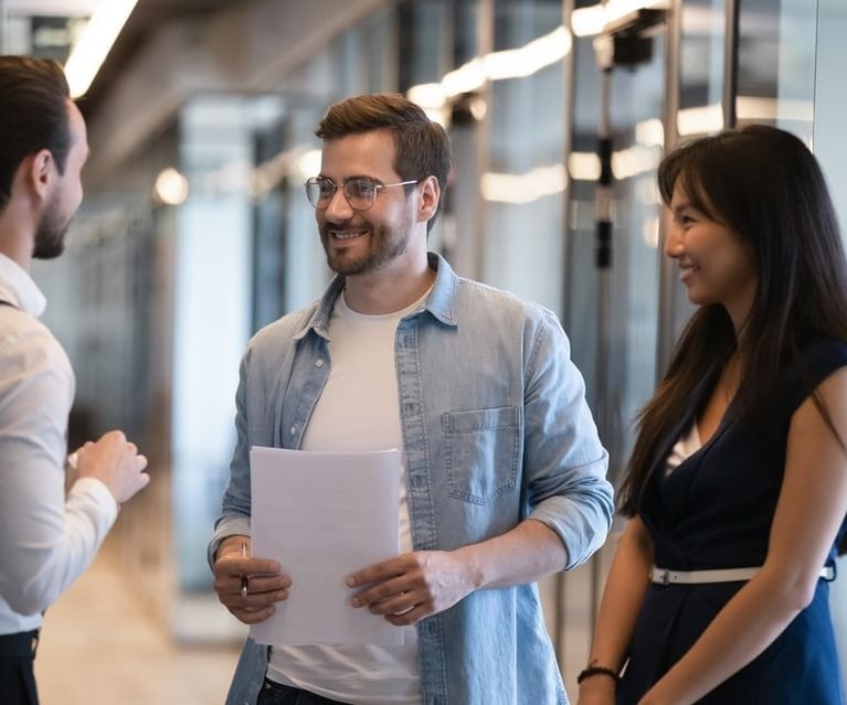 smiling-diverse-colleagues-talking-960x640.jpeg