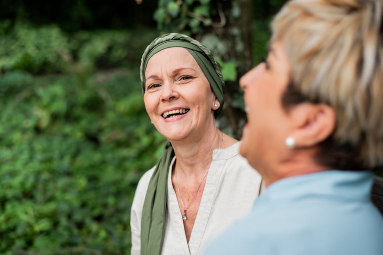 People spending time together outdoors, highlighting support, wellbeing and advances that may improve the future of cancer care.