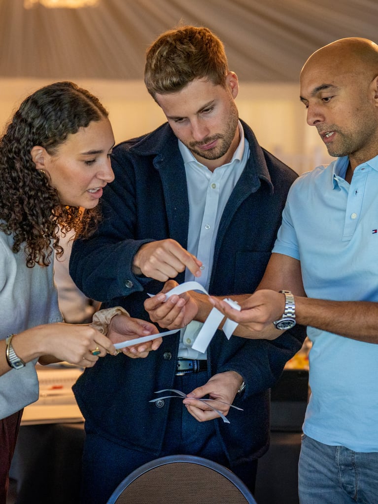 group of people looking at some papers.jpg