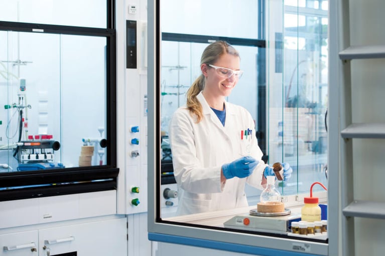 lab assistant weighing material 1