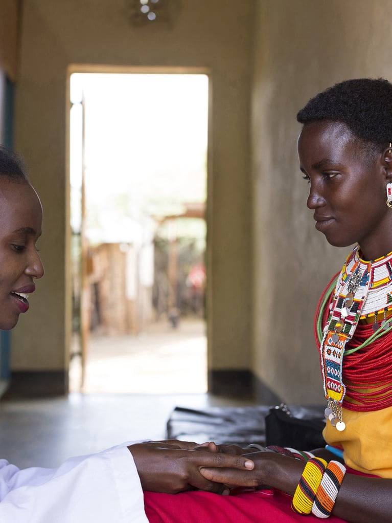 african doctor with patient