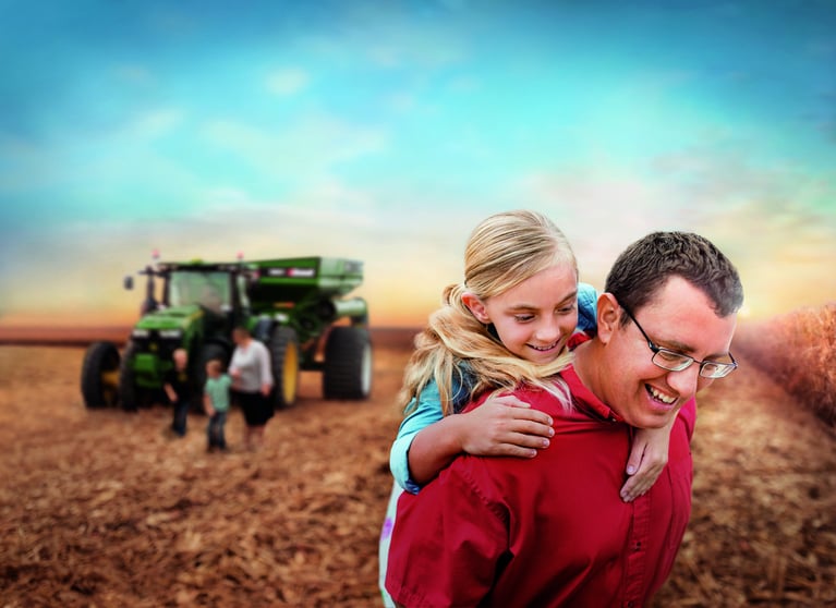 Farmer and daughter at a field