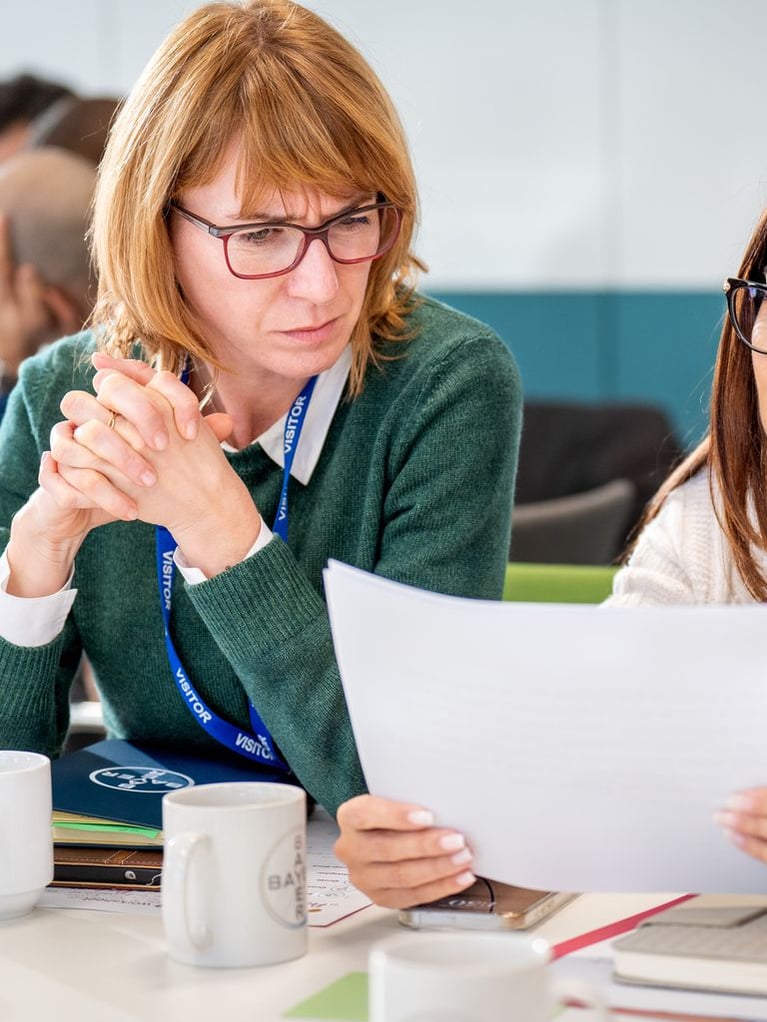 two-women-reading-paper.jpg