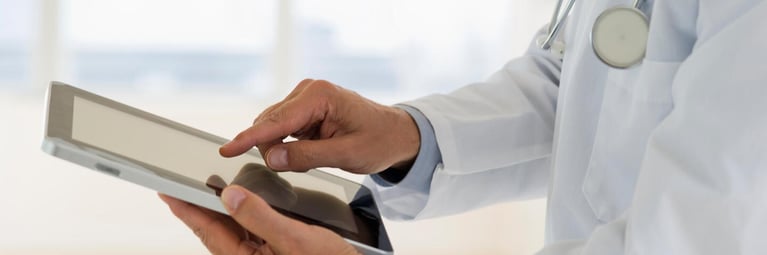 doctor_holding_digital_tablet_1440x480.jpg