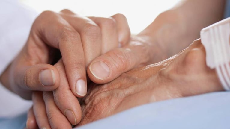 Doctor_holding_patients_hand_0 (1).jpg