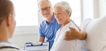 Doctor_with_elderly_couple_in_hospital_2 (1)_0.jpg