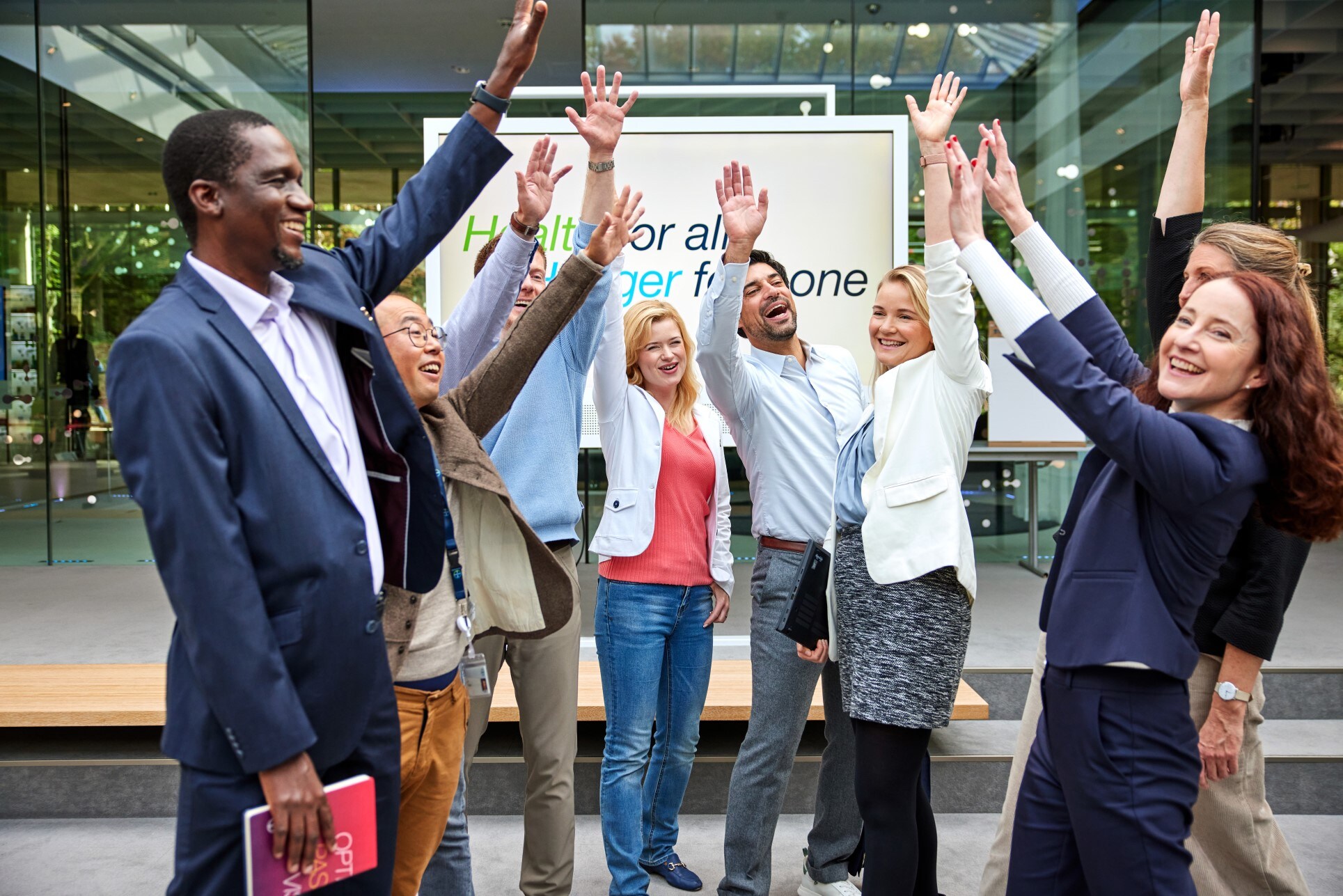 employees-raise-their-arms.jpg