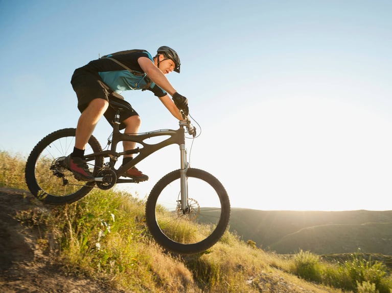 Mountainbiker_rides_downhill_3.jpg