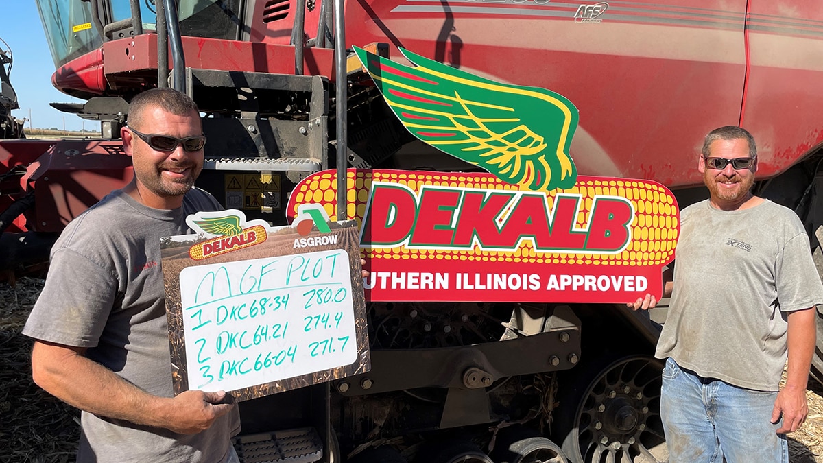 Farmer Jason Michael holding a yield sign in their fields