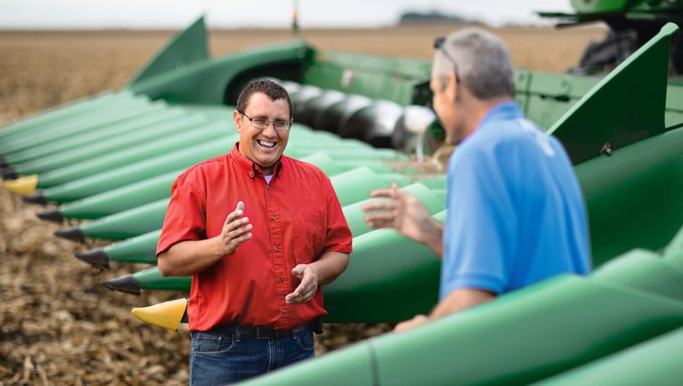 Farmer_and_consultant_at_harvester.jpg