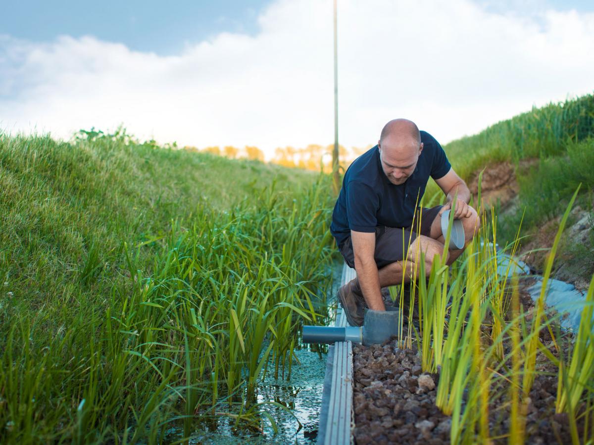 Farmer_checking_irrigation_system_0.jpg