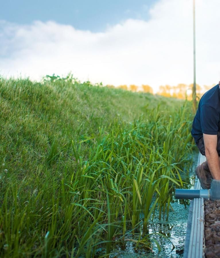 Farmer_checking_irrigation_system_0.jpg
