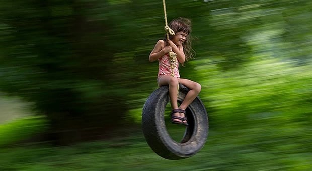 2_girl_playing_on_tire_swing_620x341.jpg