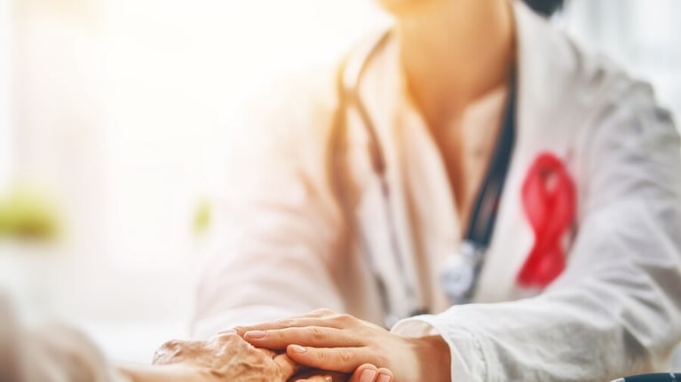 Femal_doctor_holding_patients_hand_0.jpg