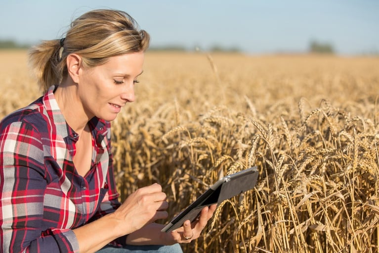 female-farmer-with-tablet-in-wheat-field-1-1200x800.jpg