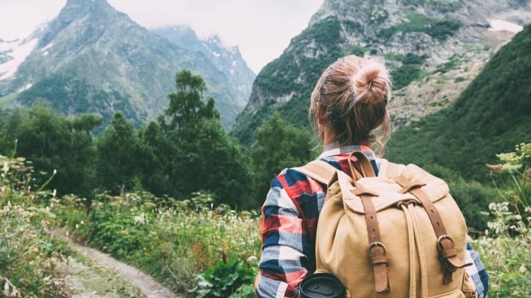 Young woman hiking in mountains