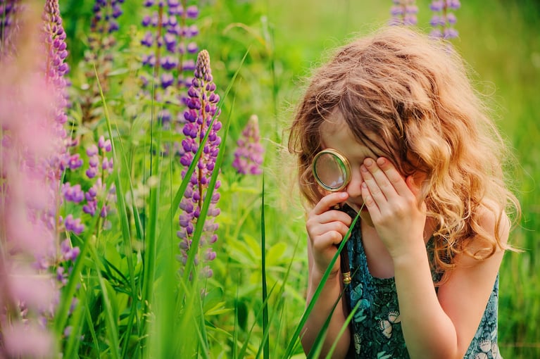 girl-with-magnifier-and-flowers-1.jpg