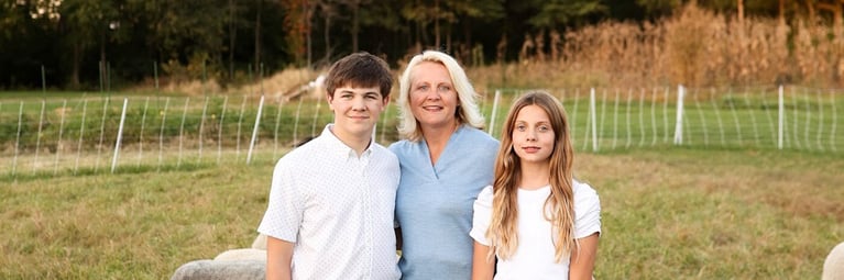 head-shot-with-sheep-and-kids.png