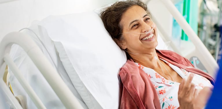 hero-pharmaceuticals-smiling-patient-in-hospital-bed_1.jpg