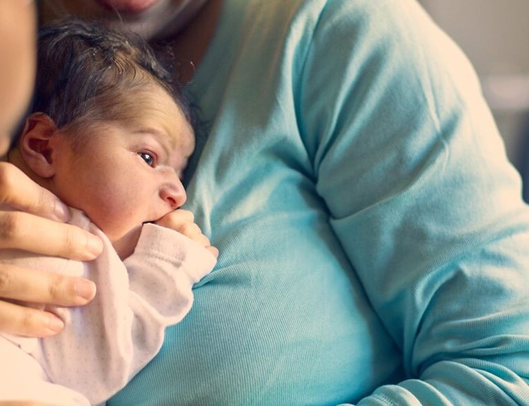 Mother_holding_newborn_1440x590.jpg