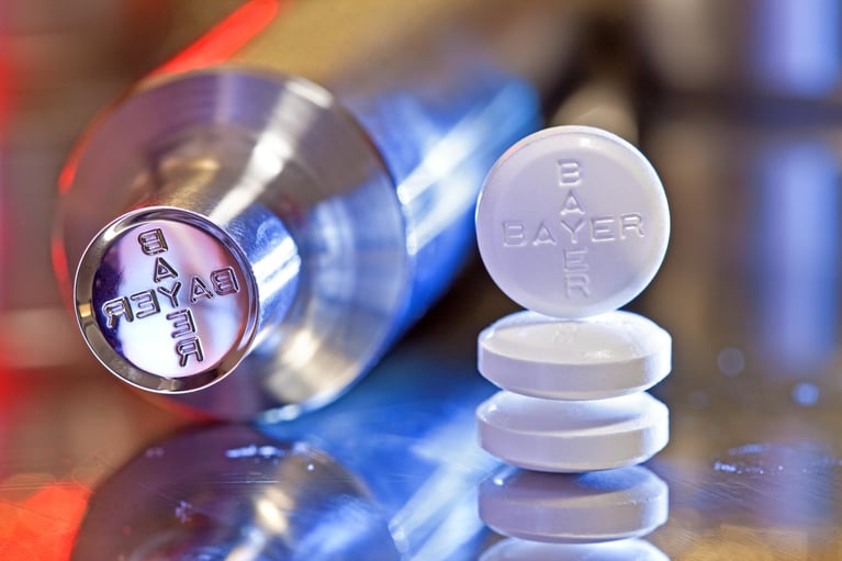 punch and tablets with Bayer logo