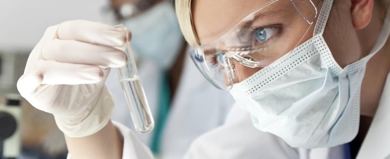 Researcher_inspecting_solution_1.jpg
