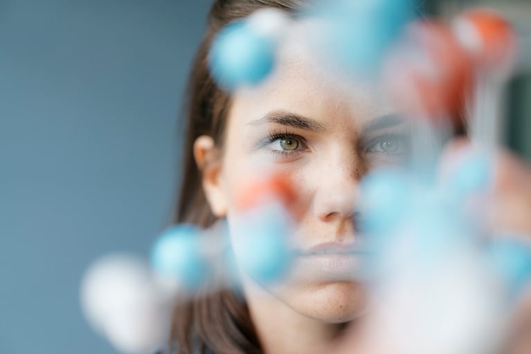 scientist studying molecule model