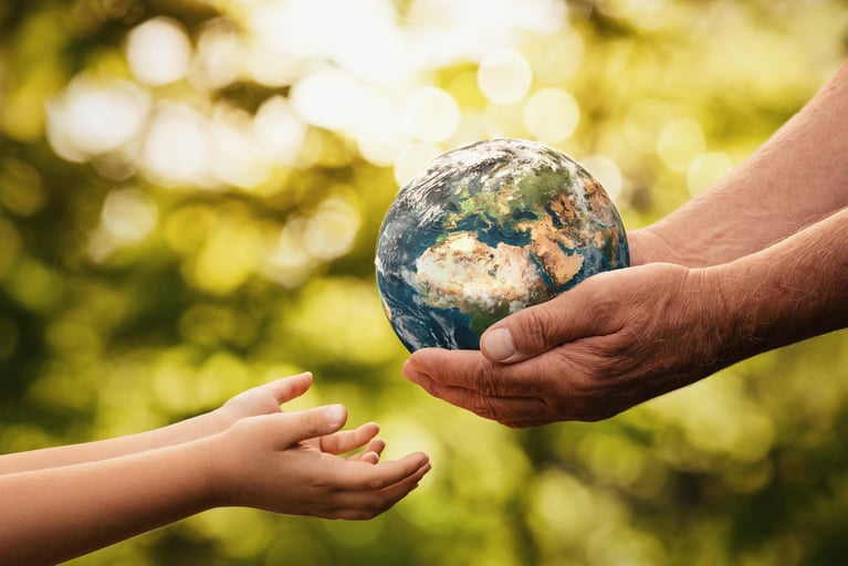 senior_hands_giving_earth_to_a_child_0.jpg