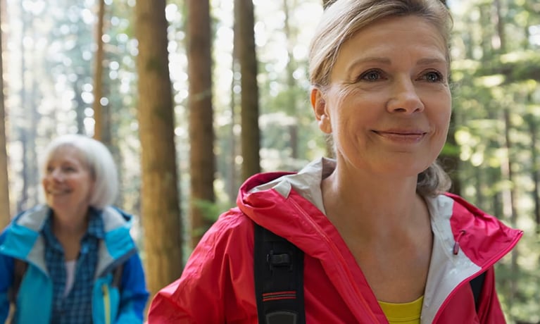 Senior_women_hiking_in_sunny_woods_1280x720_0.jpg