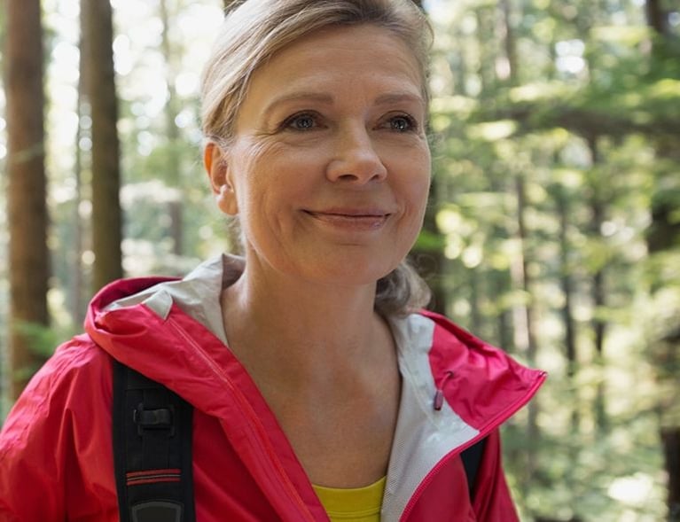 Senior_women_hiking_in_sunny_woods_1440x509.jpg