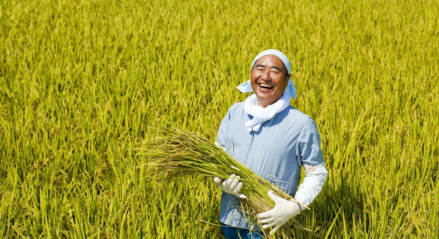 Smiling_asian_farmer_in_the_field-(1).jpg