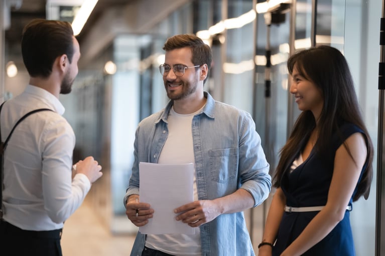 smiling-diverse-colleagues-talking.jpg