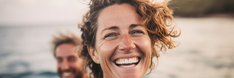 smiling-woman-at-sea.png