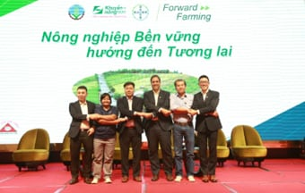 The representatives of Bayer and the NAEC with rice value partners at the farm inauguration ceremony.png