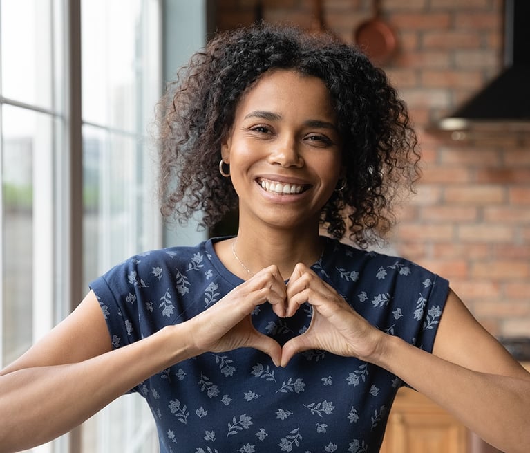woman-showing-heart-symbol.png