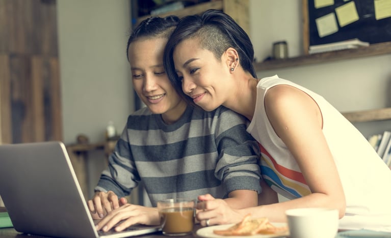 Couple looking at a laptop